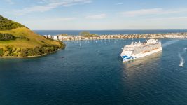 An aerial view of a cruise ship departing Pilot Bay, Mount Maunganui, New Zealand