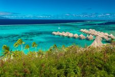 High angle shot over water bungalows at Moorea Island, Tahiti